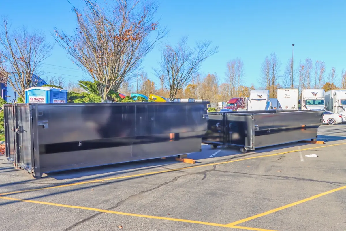 Professional dumpster rental service with roll-off container on residential driveway in Waconia